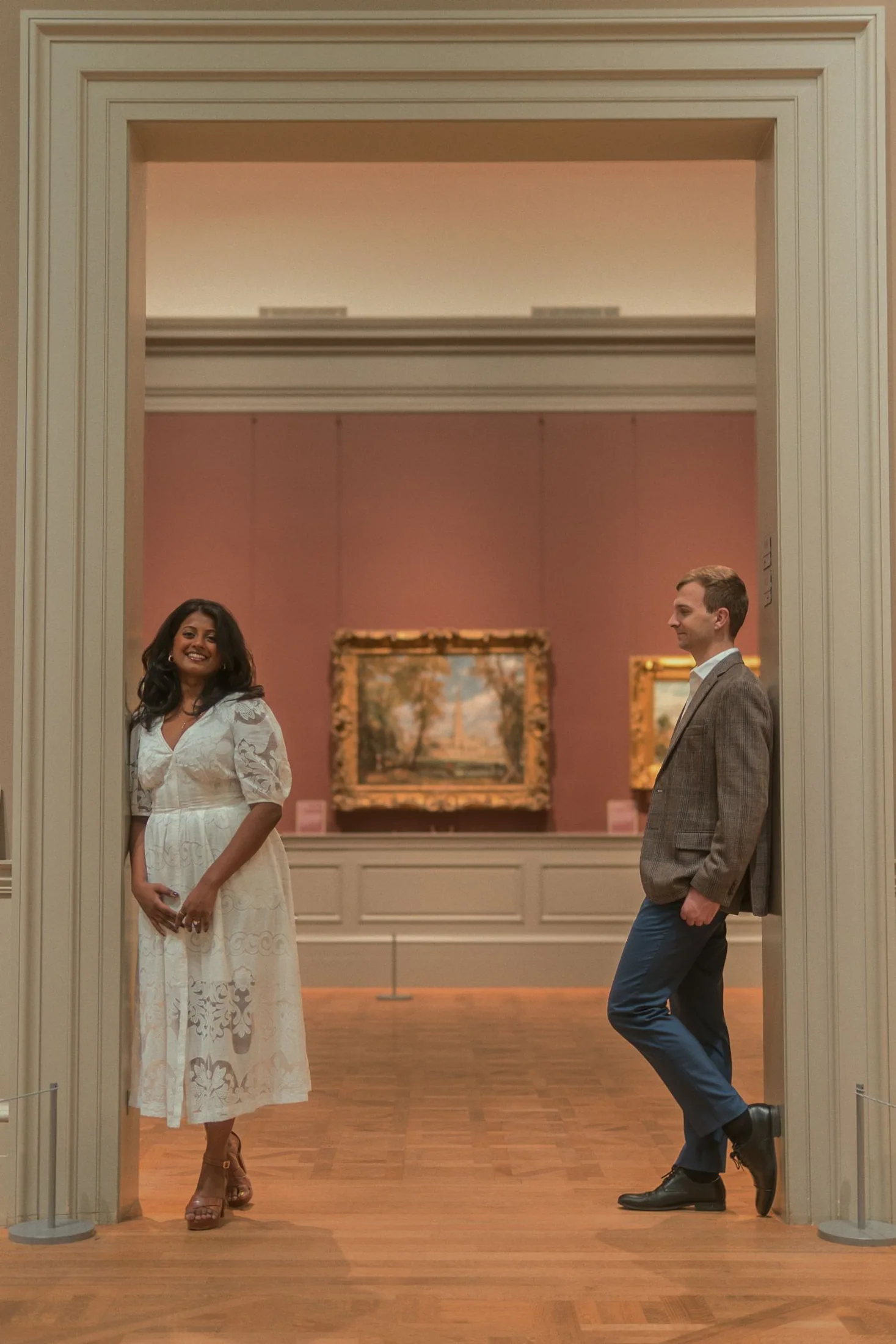 Couple framed by an elegant museum doorway