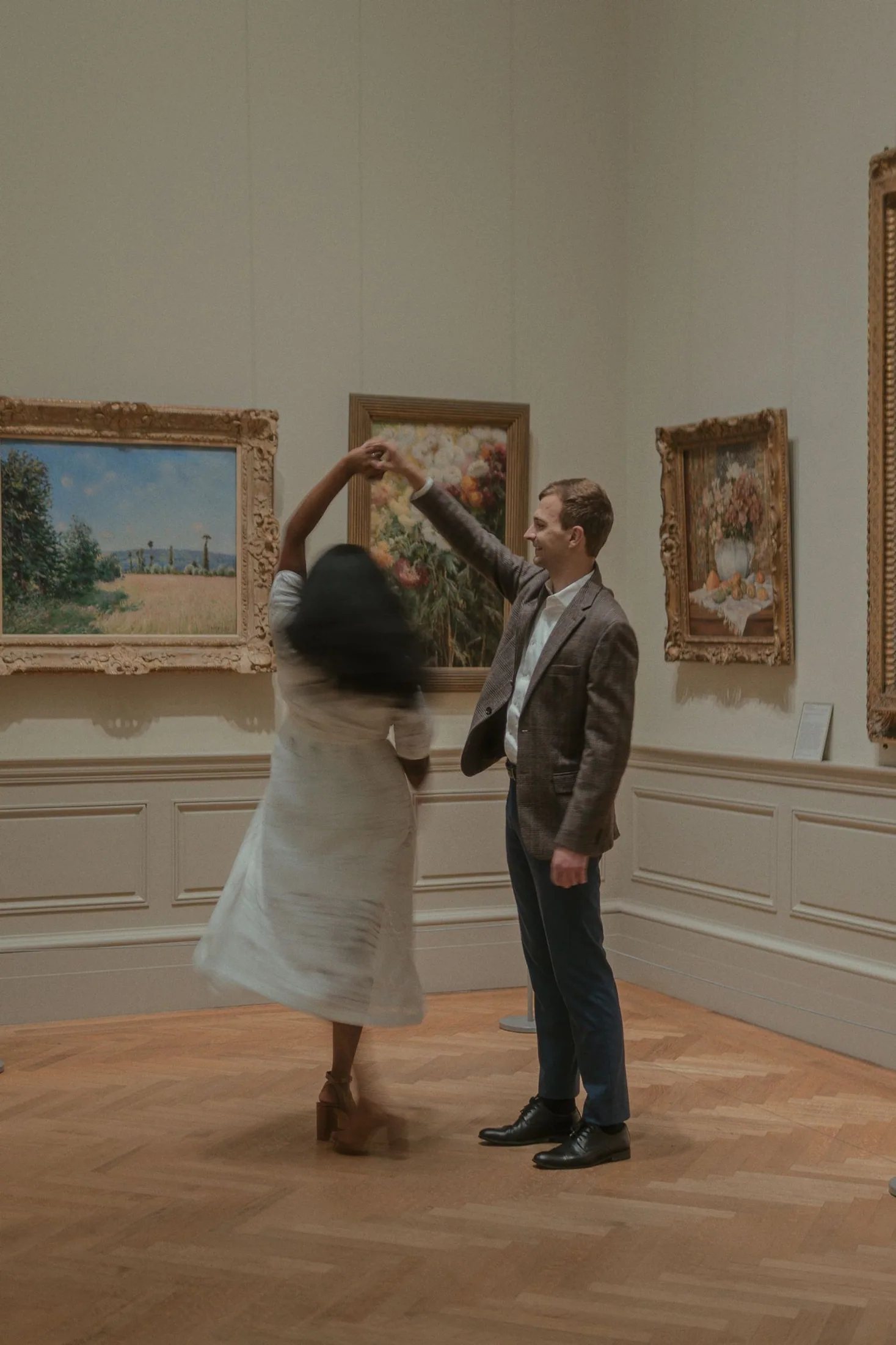 Couple standing together inside a Metropolitan Museum gallery