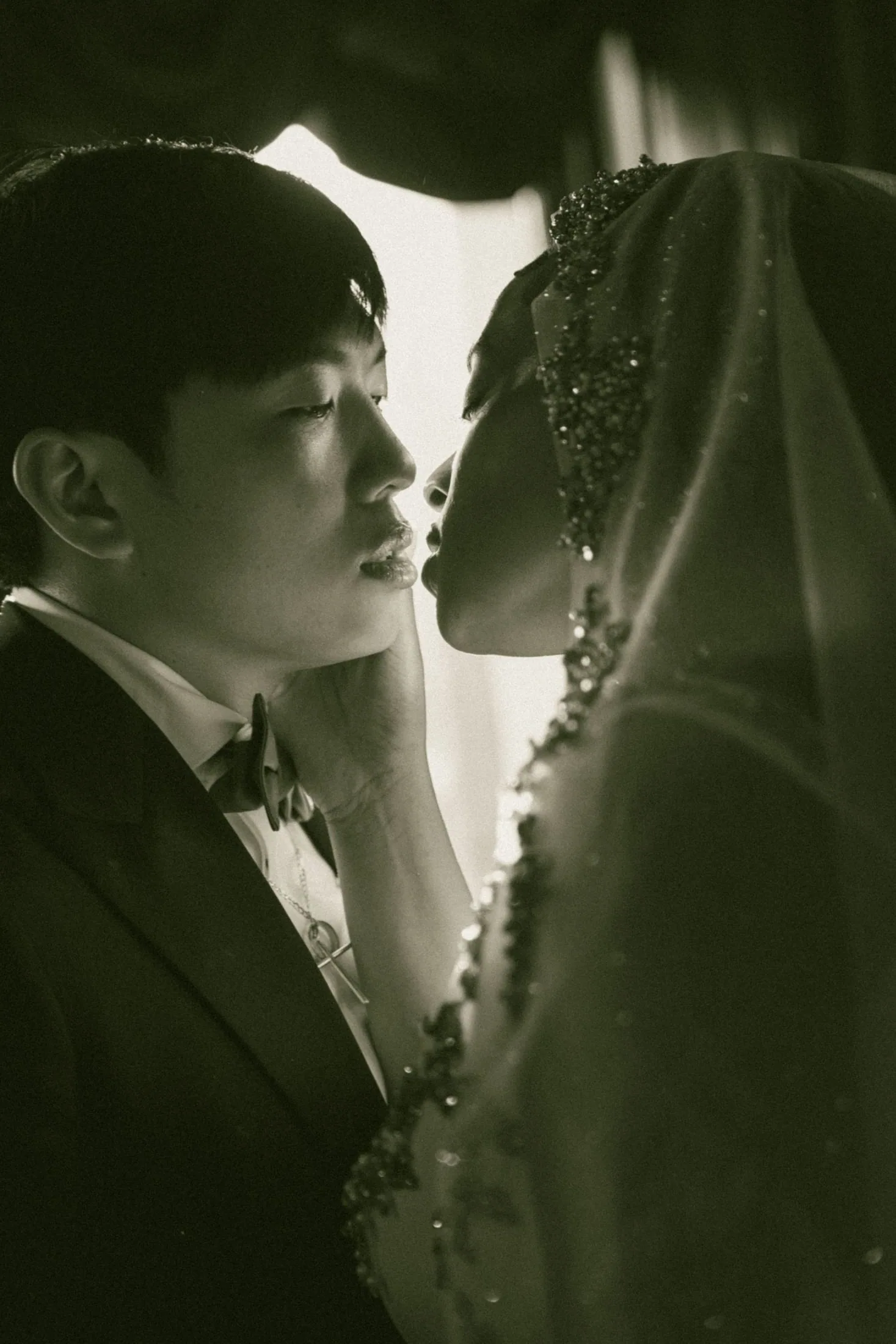 Intimate black-and-white portrait of a newlywed couple